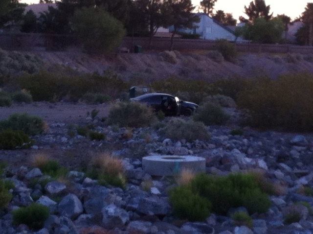 A driver crashed through a fence at Windmill and Green Valley parkways about 5:30 a.m. Thursday and landed in the Pittman Wash, Henderson police said. (Michael Quine/Las Vegas Review-Journal)
