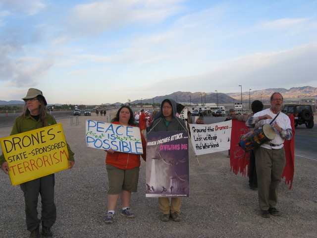 Peace protesters display anti-drone signs at Creech Air Force Base. (Courtesy Nevada Desert Experience)