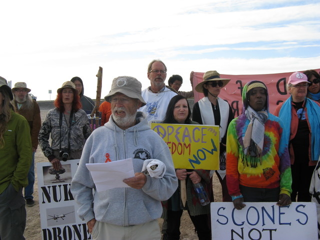 About a dozen peace protesters pull together to oppose the use of military drones at Creech Air Force Base. (Courtesy Nevada Desert Experience)