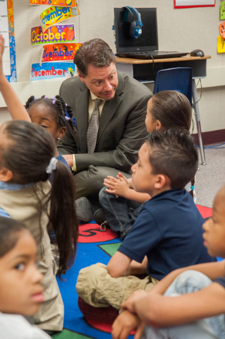 Clark County Superintendent Pat Skorkowsky, top, speaks to Kasandra Pace-Cruz, 5, while sitting in with other kindergarteners during story time at Gene Ward Elementary School in Las Vegas Thursday ...