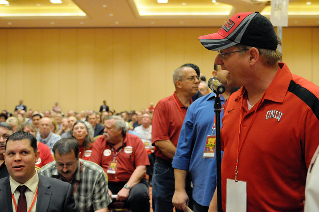 Steve Evenson, right, delegate of the Nevada Republican Party, speaks gives his opinion on an amendment during the annual Nevada Republican Party convention at the South Point casino-hotel in Las  ...