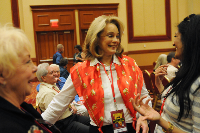 Sue Lowden, center, candidate for Nevada lieutenant governor, speaks to delegate Swati Singh, right, and Barbara Altman, former board member of the Clark County Republican Party, during the Nevada ...