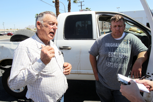 Embattled Bunkerville rancher Cliven Bundy, left, and his son Dave Bundy talk to a reporter on the corner of North Las Vegas Boulevard and East Stewart Avenue in downtown Las Vegas on Monday, Apri ...