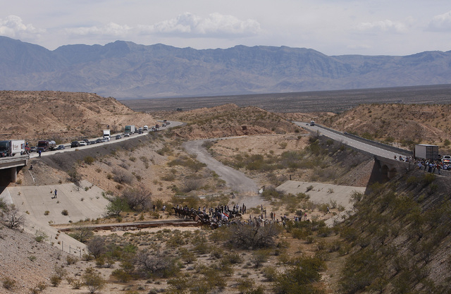 The Bundy family and their supporters gather together under the I-15 highway just outside of Bunkerville in order to confront the BLM and demand the release of their impounded cattle on April 12,  ...