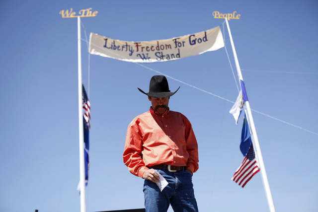 Rancher Derrel Spencer speaks during a rally in support of Cliven Bundy near Bunkerville Nev. Monday, April 7, 2014, 2014. The Bureau of Land Management has begun to round up what they call " ...