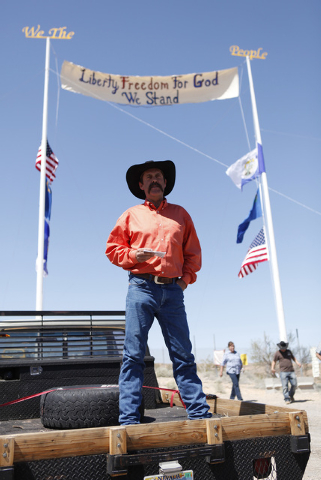 Rancher Derrel Spencer speaks during a rally in support of Cliven Bundy near Bunkerville Nev. Monday, April 7, 2014, 2014. The Bureau of Land Management has begun to round up what they call " ...