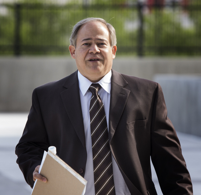 Alan Rodrigues, former general manager of National Audit Defense Network. arrives for opening statements in the tax fraud trial on Wednesday, April 16, 2014. Rodrigues along with Weston Coolidge, ...