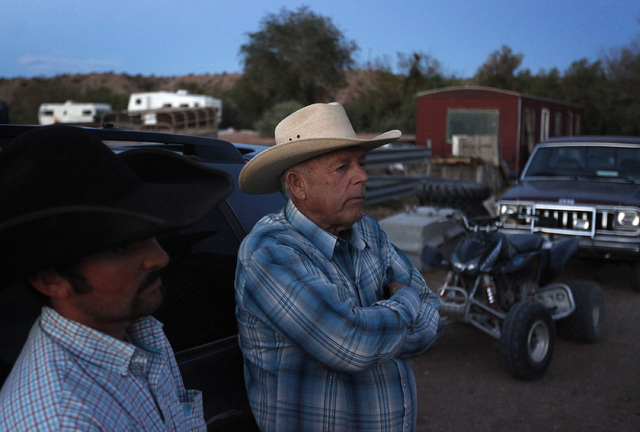 Cliven Bundy, right, and Clance Cox, left, stand at the Bundy ranch near Bunkerville Nev. Saturday, April 5, 2014. The Bureau of Land Management has begun to round up what they call "trespass ...