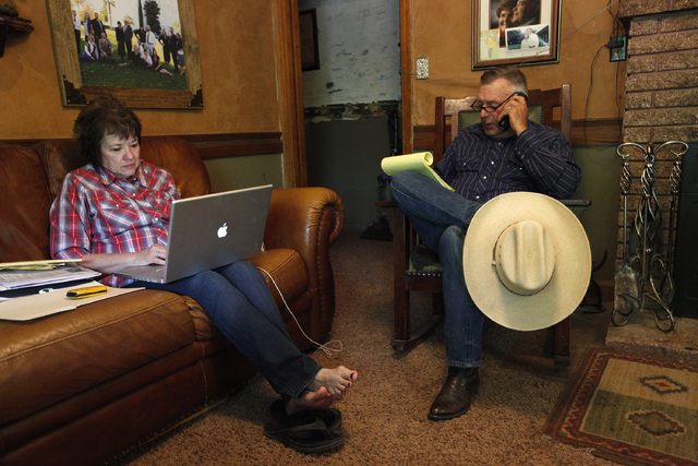 Cliven Bundy, right, and his wife Carol Bundy make calls and look online at their ranch near Bunkerville on Saturday, April 5, 2014. The Bureau of Land Management has begun to round up what they c ...