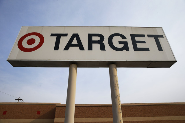 In this Tuesday, March 25, 2014 photo, a sign outside a Target store in Philadelphia is shown. Target said Monday, May 5, 2014, that Chairman, President and CEO Gregg Steinhafel is out, nearly fiv ...