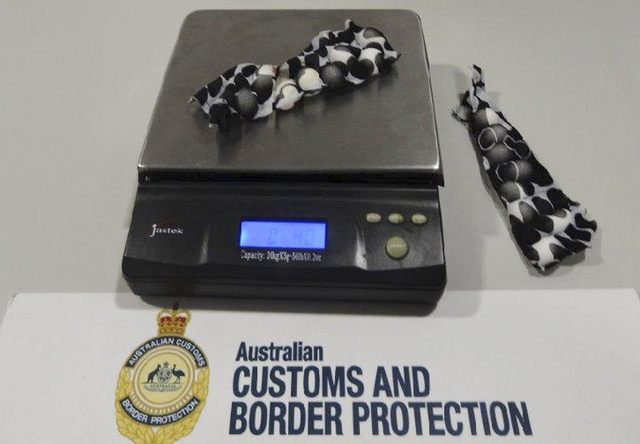 This Tuesday, May 20, 2014 photo provided by Australian Customs and Boarder Protection Service shows small bird eggs hidden in strips of fabric which were removed from a traveler at Sydney interna ...