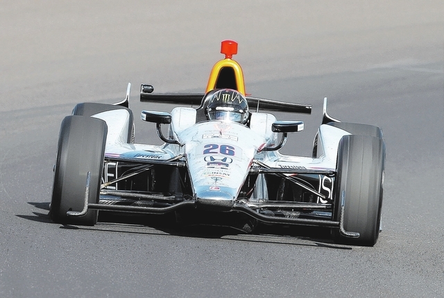 In this May 18, 2014 file photo, Kurt Busch drives through the first turn during qualifications for Indianapolis 500 IndyCar auto race at the Indianapolis Motor Speedway in Indianapolis. Busch wi ...