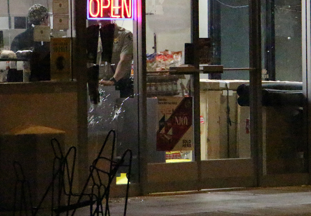 In this image provided by KEYT-TV, police investigate a scene after a mass shooting near the campus of the University of Santa Barbara in Isla Vista, Calif., Friday, May 23, 2014. A drive-by shoo ...
