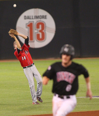 San Diego State's Evan Potter (14) catches a fly ball from UNLV to end the first inning as UNLV's Erik VanMeetren (8) heads for third base during a game in the Mountain West baseball tournament at ...