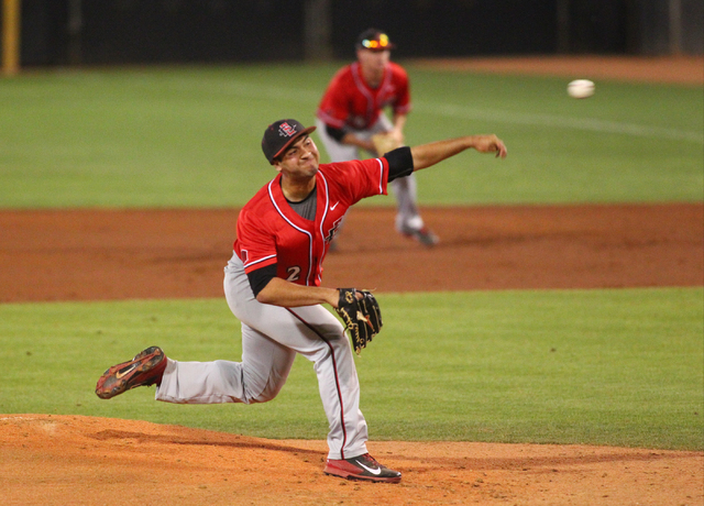 San Diego State's Michael RoBards fires a pitch to UNLV during a game in the Mountain West baseball tournament at Earl E. Wilson Stadium in Las Vegas on Friday, May 23, 2014. (Chase Stevens/Las Ve ...