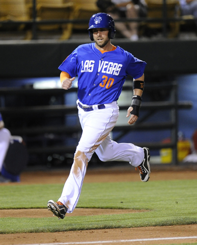 Las Vegas 51s right fielder Andrew Brown scores a run in the sixth inning of a Triple-A minor league baseball game against the Sacramento River Cats at Cashman Field in Las Vegas Friday, May 23, 2 ...