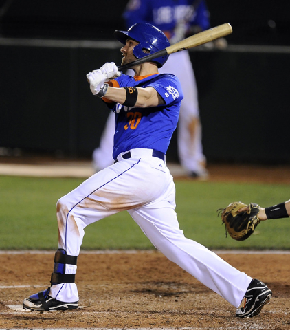 Las Vegas 51s right fielder Andrew Brown hits a deep fly ball in the seventh inning of a Triple-A minor league baseball game against the Sacramento River Cats at Cashman Field in Las Vegas Friday, ...
