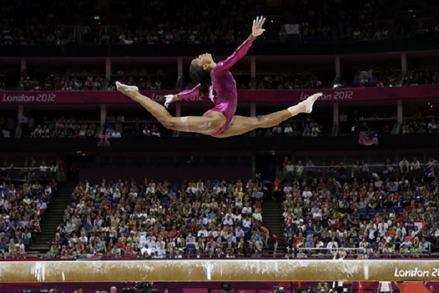 U.S. gymnast Gabrielle Douglas performs on the balance beam during the artistic gymnastics women’s individual all-around competition at the 2012 Summer Olympics, Thursday, Aug. 2, 2012, in Londo ...