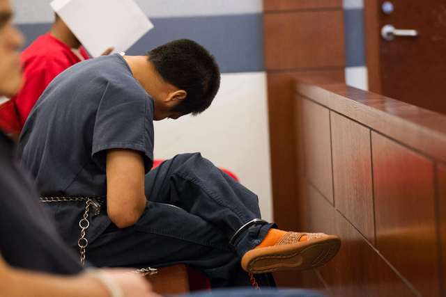 Murder suspect Jonathan Perez, 22, sits during a preliminary hearing in front of Judge Ann Zimmerman at the Regional Justice Center in Las Vegas on Friday, May 9, 2014. Perez is accused of shootin ...