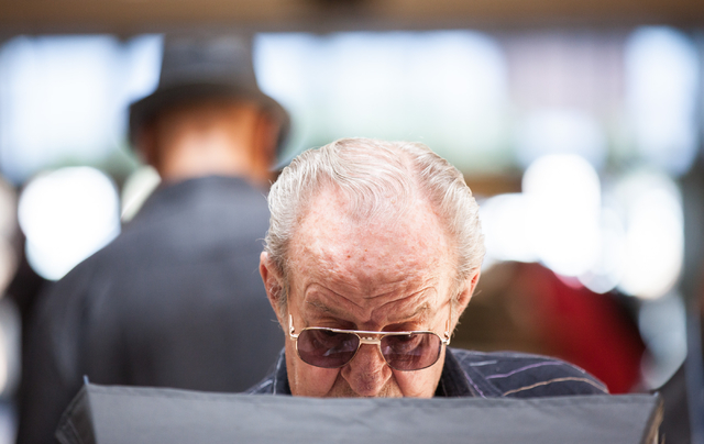 Aubrey Roberson of Las Vegas casts his ballot on the first day of early voting at the Meadows Mall in Las Vegas on Saturday, May 24, 2014. (Chase Stevens/Las Vegas Review-Journal)