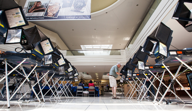 James Green of Las Vegas casts his ballot on the first day of early voting at the Meadows Mall in Las Vegas on Saturday, May 24, 2014. (Chase Stevens/Las Vegas Review-Journal)