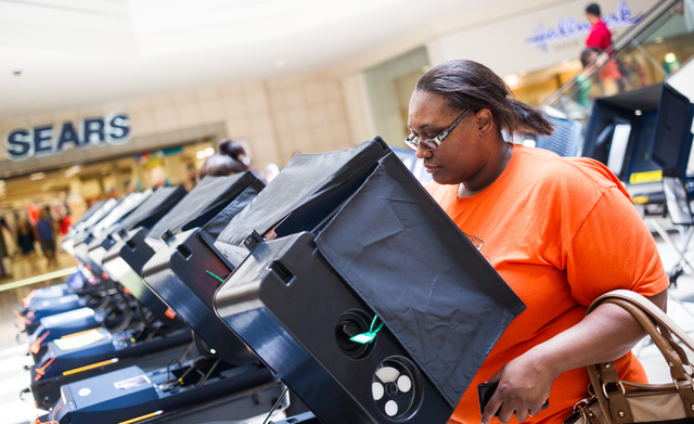 Deshonda Whiteside of Las Vegas casts her ballot on the first day of early voting at the Meadows Mall in Las Vegas on Saturday, May 24, 2014. (Chase Stevens/Las Vegas Review-Journal)