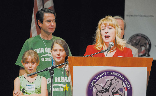 Congressional candidate Erin Bilbray speaks during the Clark County Democratic Party convention at the Tropicana  in Las Vegas on May 3, 2014. Her husband, Noah, left, stands with their daughters  ...
