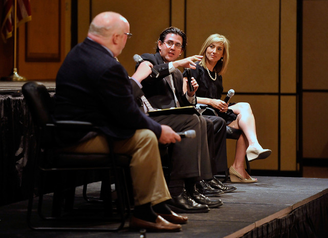 Jeremy Aguero, center, principal analyst with Applied Analysis, speaks between Dan Hart, left, political consultant advising the Nevada State Education Association and Karen Griffin, spokesperson  ...