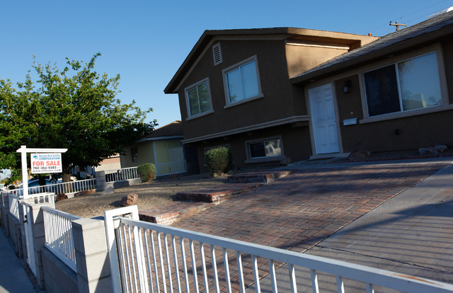 A for sale sign is seen at a home on Parsifal Place near Wallace Drive in the 89107 zip code of Las Vegas on Wednesday, April 30, 2014. Home values in 89107 increased 53.2% in 2013. (Chase Stevens ...