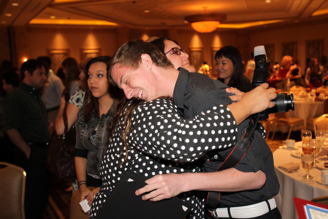 Austin Connell, who is graduating from Mountain View Christian School, hugs his yearbook advisor Amanda Holcombe-Hanson after he received a $2,000 scholarship at the Las Vegas Review-Journal 38th  ...