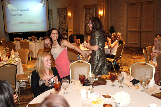 Moriah Hernandez, left, and Katie Rosso, co-editors of the Green Valley High School The InvestiGator, run to the podium after their publication was named best standard-format newspaper at the Las ...