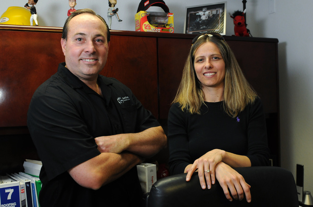 Rebecca Merrihew, right, and Rick Preston, co-owners of Red Rock Insulation in Las Vegas, pose for a portrait at their warehouse Friday, May 9, 2014. (Erik Verduzco/Las Vegas Review-Journal)