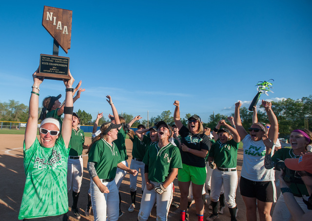 Palo Verde head coach Kelly Glass holds up the state championship trophy after her team defeated Reed 12-8 to capture the Division I state title. (Kevin Clifford/Special to the Review-Journal)