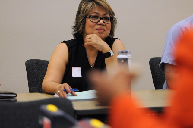 Maria Grace Hill, a bilingual Tagalog speaker, listens during a poll worker training class at the Clark County Election Center Office in North Las Vegas Wednesday, May 21, 2014. (Erik Verduzco/Las ...