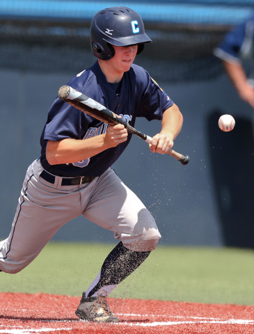 Centennial's Hayden Grant puts down a sacrifice bunt in the third inning of the Division I state championship game o Saturday. Liberty defeated the Bulldogs 5-3 for the title. (Cathleen Allison/Sp ...