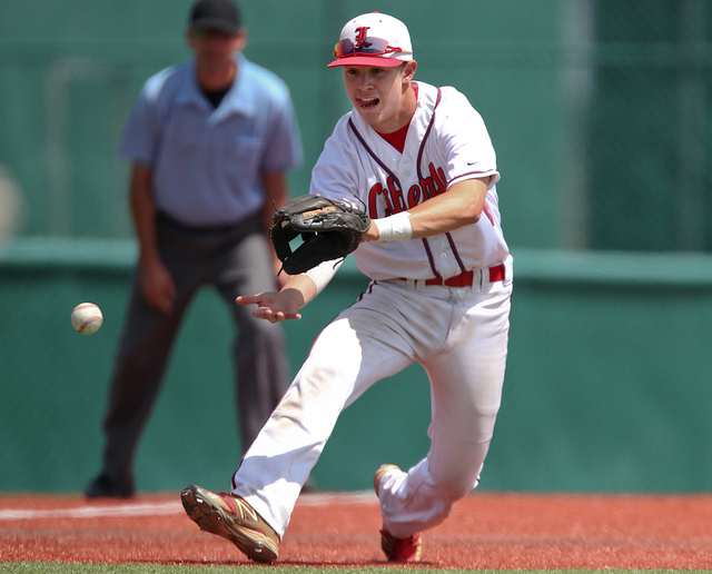 Liberty third baseman Nick Rush fields a grounder against Centennial in the Division I state championship game on Saturday. Liberty defeated Centennial 5-3 to win the title. (Cathleen Allison/Spec ...