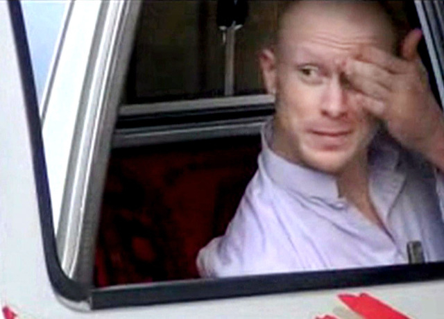 In this image taken from video obtained from Voice Of Jihad Website, Sgt. Bowe Bergdahl, sits in a vehicle guarded by the Taliban in eastern Afghanistan. The Taliban on Wednesday, June 4, 2014, re ...