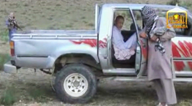 In this image taken from video obtained from Voice Of Jihad Website, Sgt. Bowe Bergdahl sits in a vehicle guarded by the Taliban in eastern Afghanistan. The Taliban have released a video showing t ...