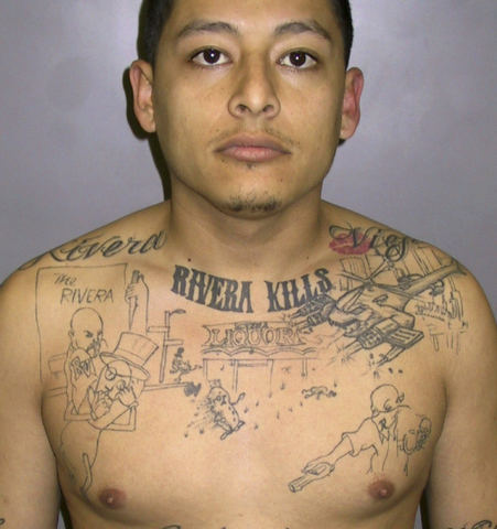 Convicted murderer Anthony Garcia, sentenced to 65 years in prison in 2011 after a homicide investigator discovered he had the scene of an unsolved 2004 murder inked on his chest.   (AP Photo/Los  ...
