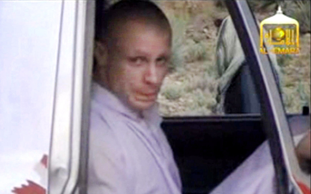 In this image taken from video obtained from Voice Of Jihad Website, which has been authenticated based on its contents and other AP reporting, Sgt. Bowe Bergdahl sits in a vehicle guarded by the  ...