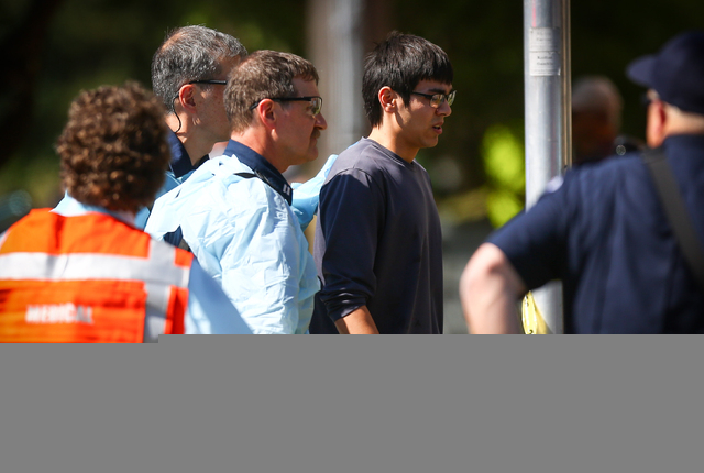 Jon Meis is taken from the scene by medics after a shooting at Seattle Pacific University on Thursday, June 5, 2014 in Seattle. A 19-year-old man was fatally shot and two other young people were w ...