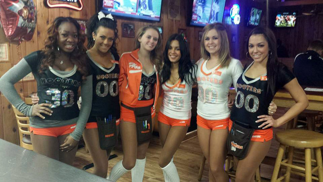 Jonny Cabral, fourth from left, poses with her fellow Hooters Girls at Hooters in Spring Valley. (Courtesy, Jonny Cabral/Facebook)