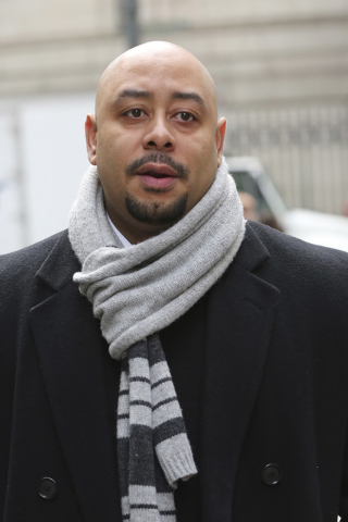 In this Jan. 17, 2013 file photo, Raymond Santana is photographed during a rally outside Federal court in New York. A city official said Friday, June 20, 2014 that New York City has agreed to a $4 ...