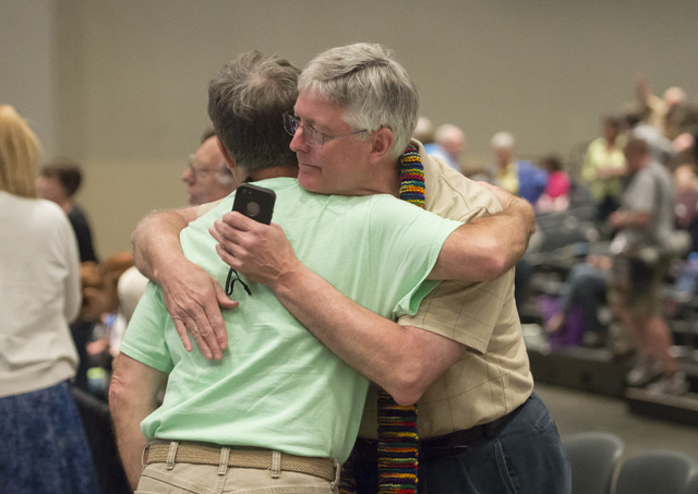 Gary Lyon, of Leechburg, PA, left, and Bill Samford, of Hawley, PA., celebrate after a vote allowing Presbyterian pastors discretion in marrying same-sex couples at the 221st General Assembly of t ...