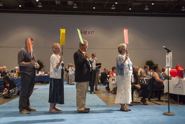 Commissioners and advisors wait in line to debate a vote on whether the church should recognize same-sex marriage at the 221st General Assembly of the Presbyterian Church at Cobo Hall, in Detroit ...