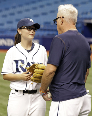 Chelsea Baker, a junior knuckleball pitcher on the Durant, Fla., High School boys baseball team, talks to Tampa Bay Rays manager Joe Maddon before throwing batting practice to members of the Rays ...