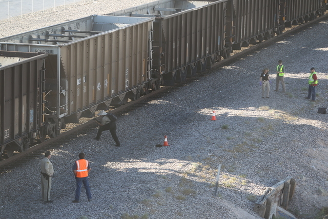 Police investigate scene where man was killed by train near Valley View and Hacienda on Wednesday. (K.M Cannon/Las Vegas Review-Journal)