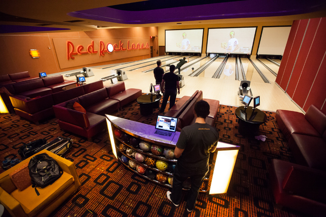 Rolltech founder and CEO Rich Belsky, top, rolls a bowling ball at Red Rock Lanes in Red Rock Resort in Las Vegas on May 29. (Chase Stevens/Las Vegas Review-Journal)