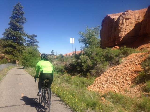 Nancy, a bicyclist tourist from Sacramento, Calif., bikes on a paved trail through Red Canyon on the way to Bryce Canyon National Park. (ALAN SNEL/LAS VEGAS REVIEW-JOURNAL)