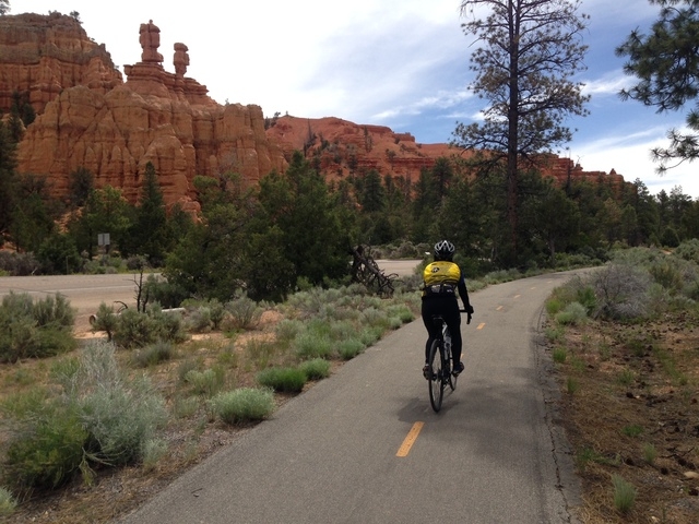 Nancy, a bicyclist tourist from Sacramento, Calif., bikes on a paved trail through Red Canyon on the way to Bryce Canyon National Park. (ALAN SNEL/LAS VEGAS REVIEW-JOURNAL)